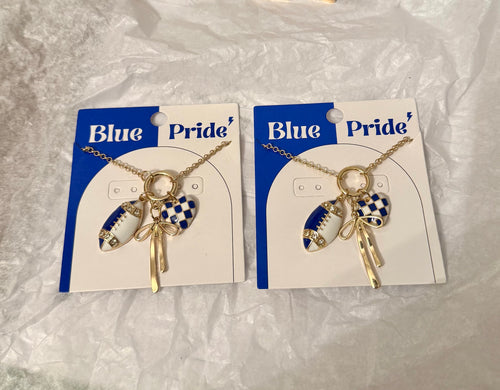 Two Blue Pride necklaces with gold-tone chains, blue-and-white football charms, checkered hearts, and bow details.
